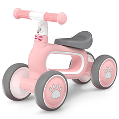 DRAMATION baby balance bike pink front view showing compact circular body for easy indoor storage.