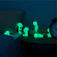 Dreams Smiski glow-in-the-dark figurine provides a gentle glow for late reading