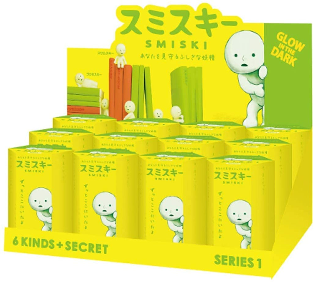 Dreams Smiski glow-in-the-dark figure displayed on a dim shelf for cozy ambience.