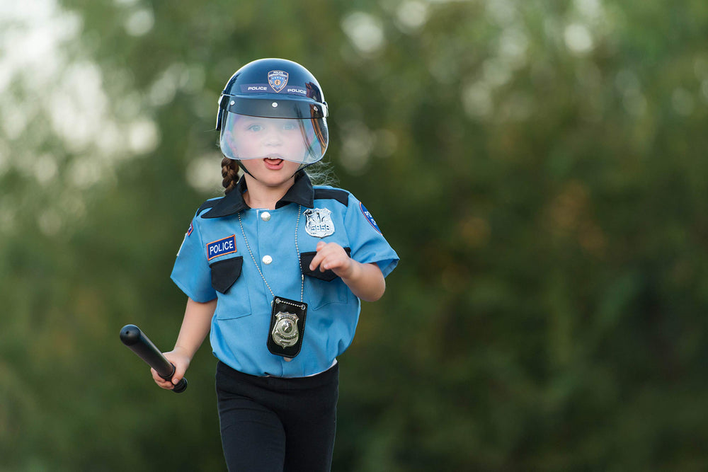 Dress Up America kids wearing police helmet during pretend play.