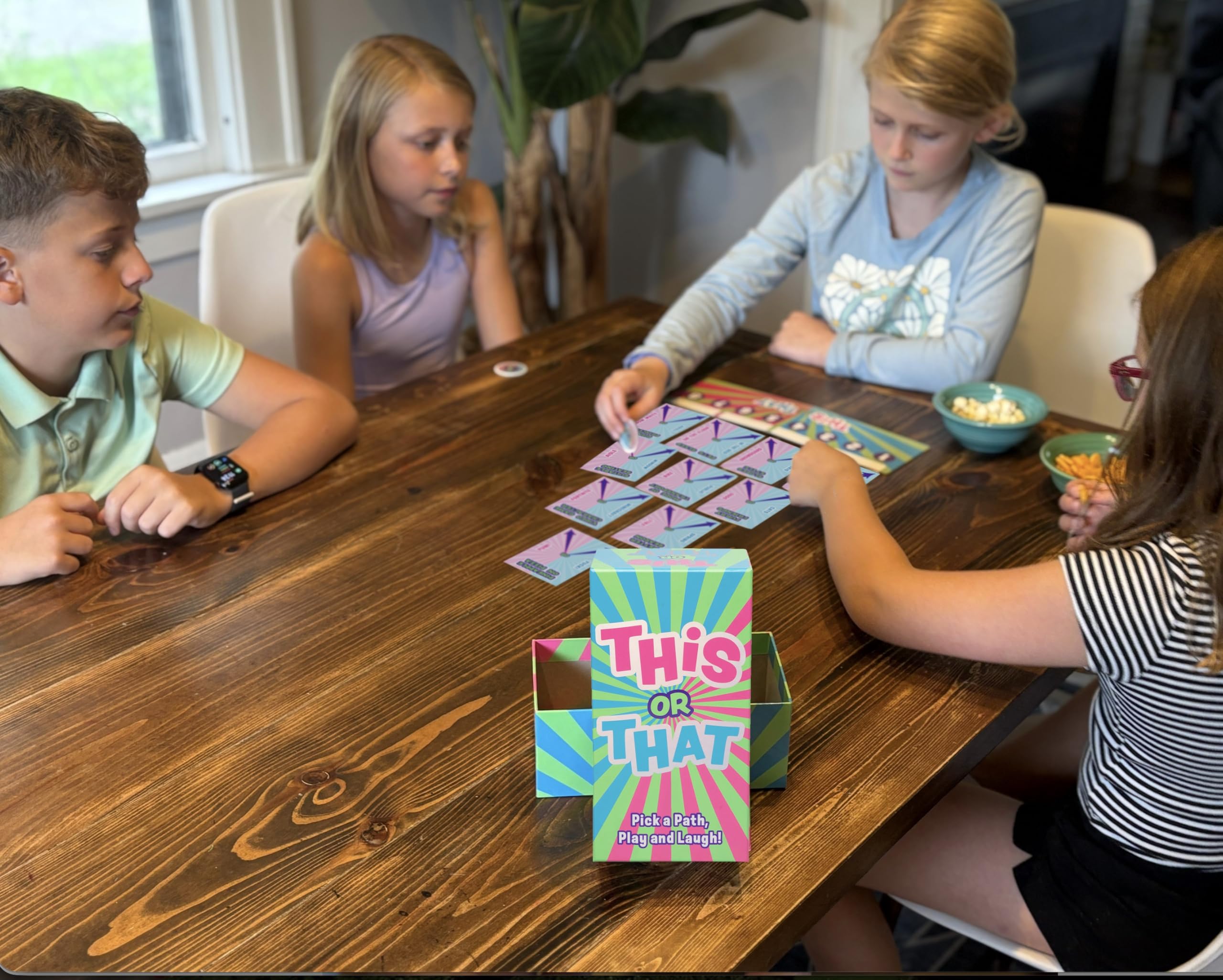 DYCE Family game night in action with laughing players and cozy vibes