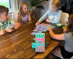 DYCE Family game night in action with laughing players and cozy vibes