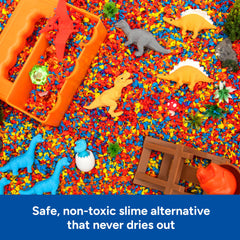 Educational Insights Pluffle in a sensory bin while child scoops, promoting fine motor practice