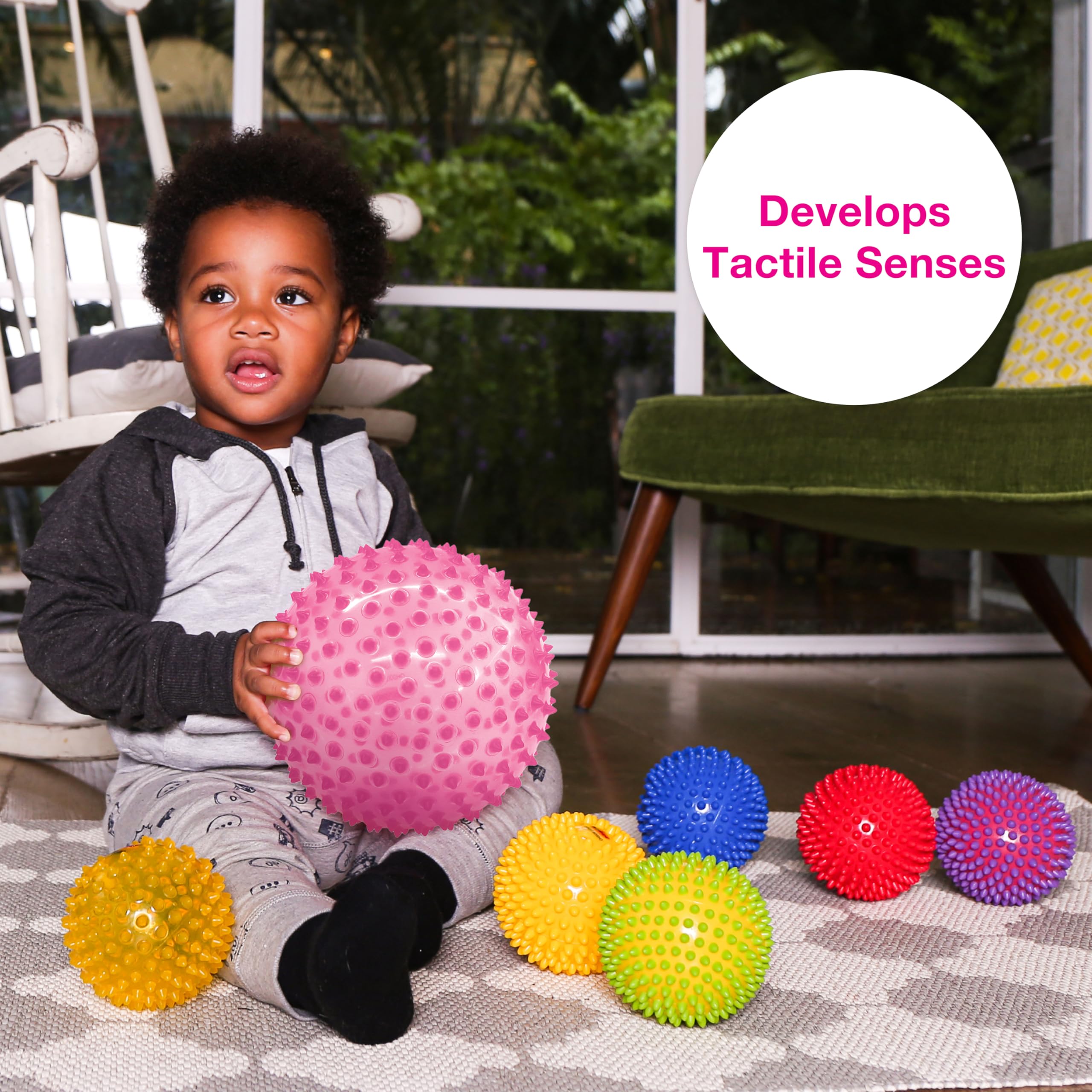 Edushape sensory ball on crawling play, promotes movement and balance.