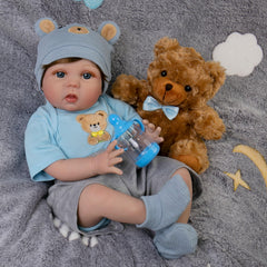 EKOKIZ Reborn 22-inch Dan with soft body offers gentle, lifelike cuddling.