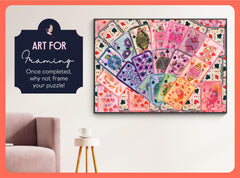 Puzzle packaging from Elena Essex features brand artwork and card motif