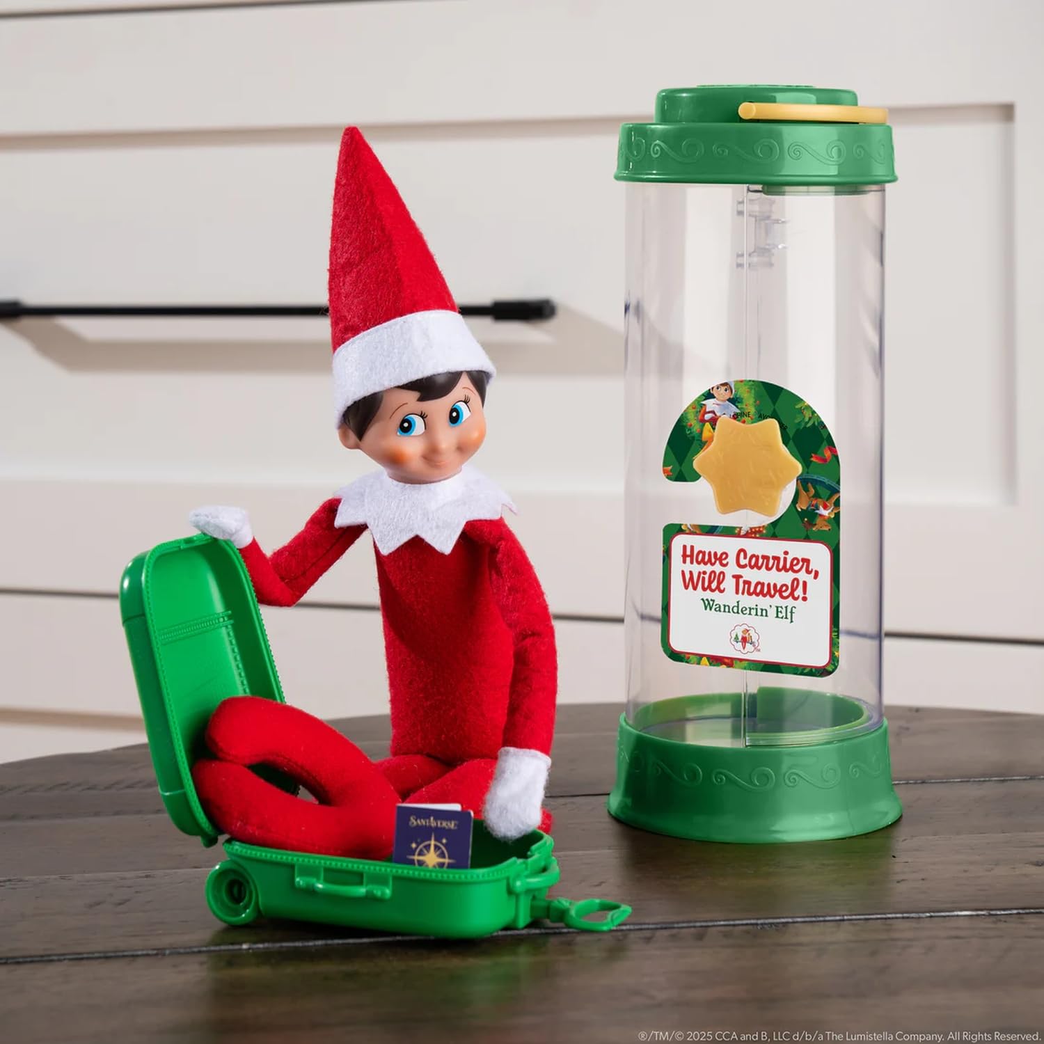 The Elf on the Shelf Collectible Tin Suitcase keeps outfits organized on the go.
