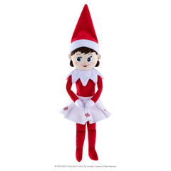 Child holds Elf on the Shelf Plushee Pals for year-round fun.