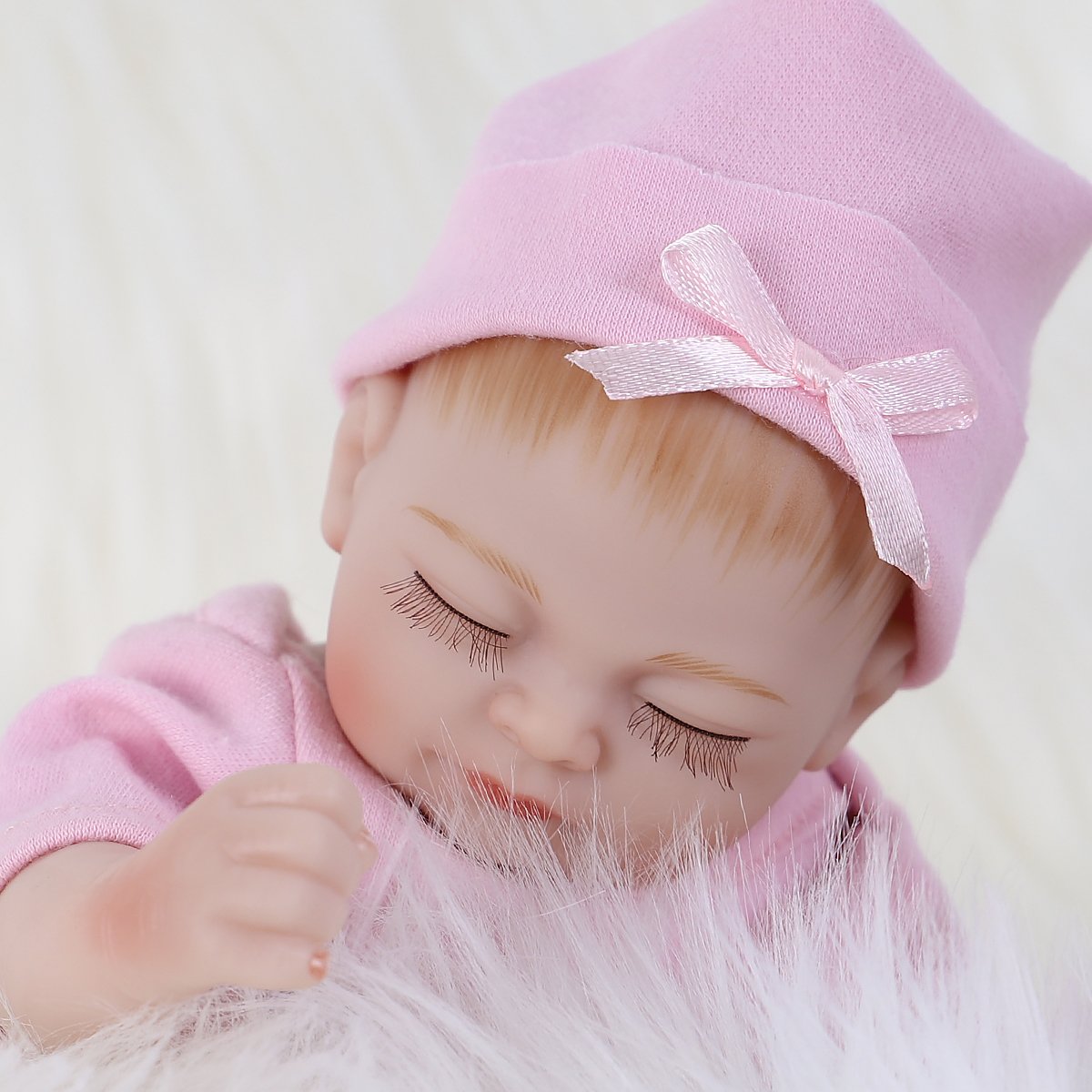 ENADOLL reborn baby doll with soft vinyl and silicone blend for a lifelike feel.