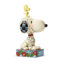 Enesco Snoopy and Woodstock figurine with joyful pose, ideal for shelf display.