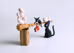Close-up of Ensky Jiji figure on a tidy desk.