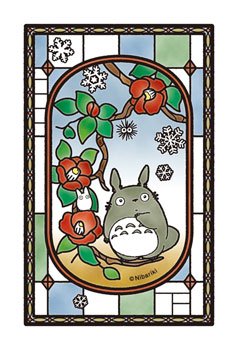 Ensky Blooming Camellia puzzle display with stained-glass-like glow on windows.
