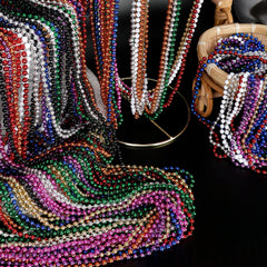 Beads displayed in parade setup highlighting universal 33-inch length