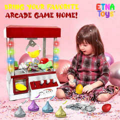 Etna claw machine close-up showing three levers used for token play.