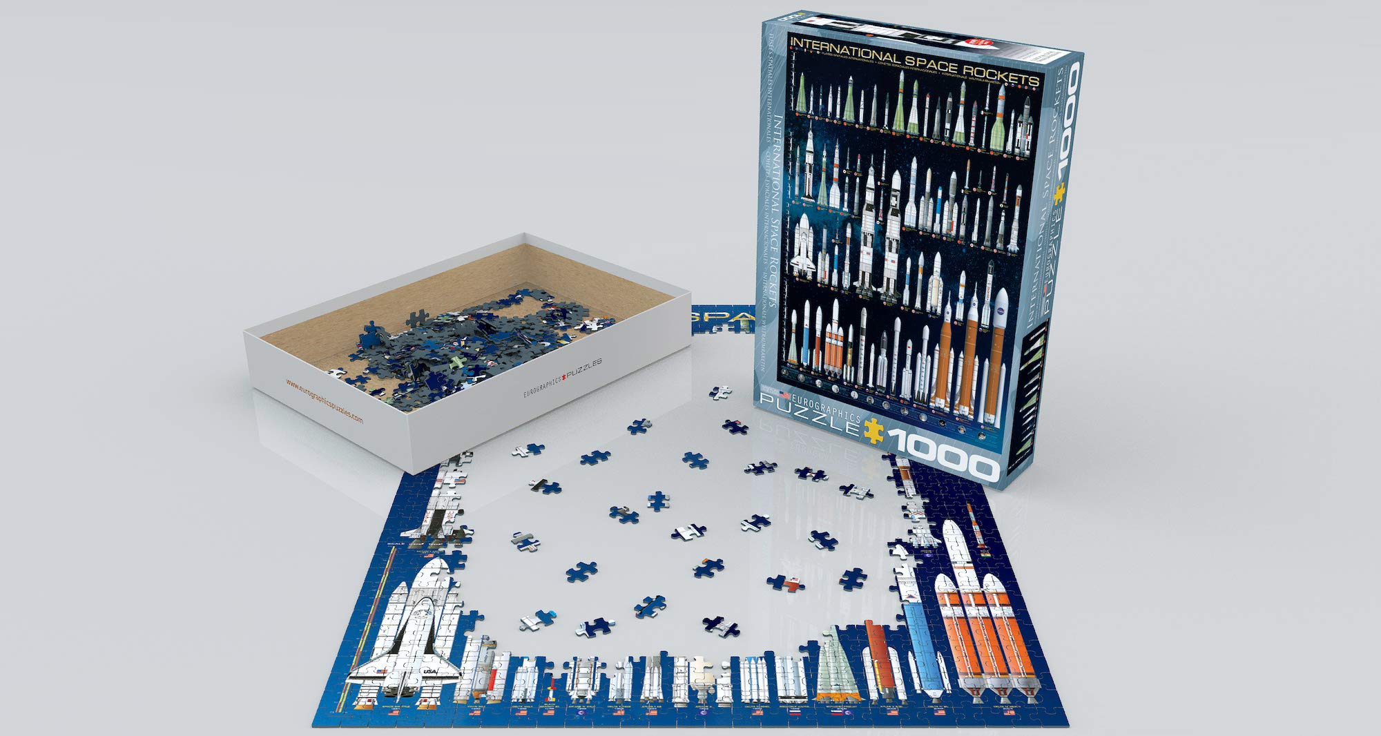 EuroGraphics Space Rockets puzzle pieces close-up, highlighting smooth fit on high-quality blue board.