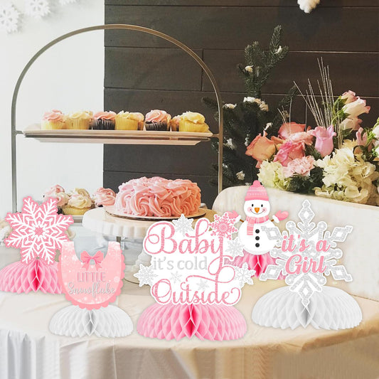 Fangleland winter snowflake honeycomb centerpieces in pink-white brighten gender reveal tables.
