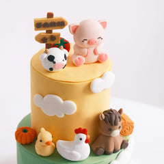 Farm Animal Cake Toppers: pumpkin topper adds seasonal color and festivity.