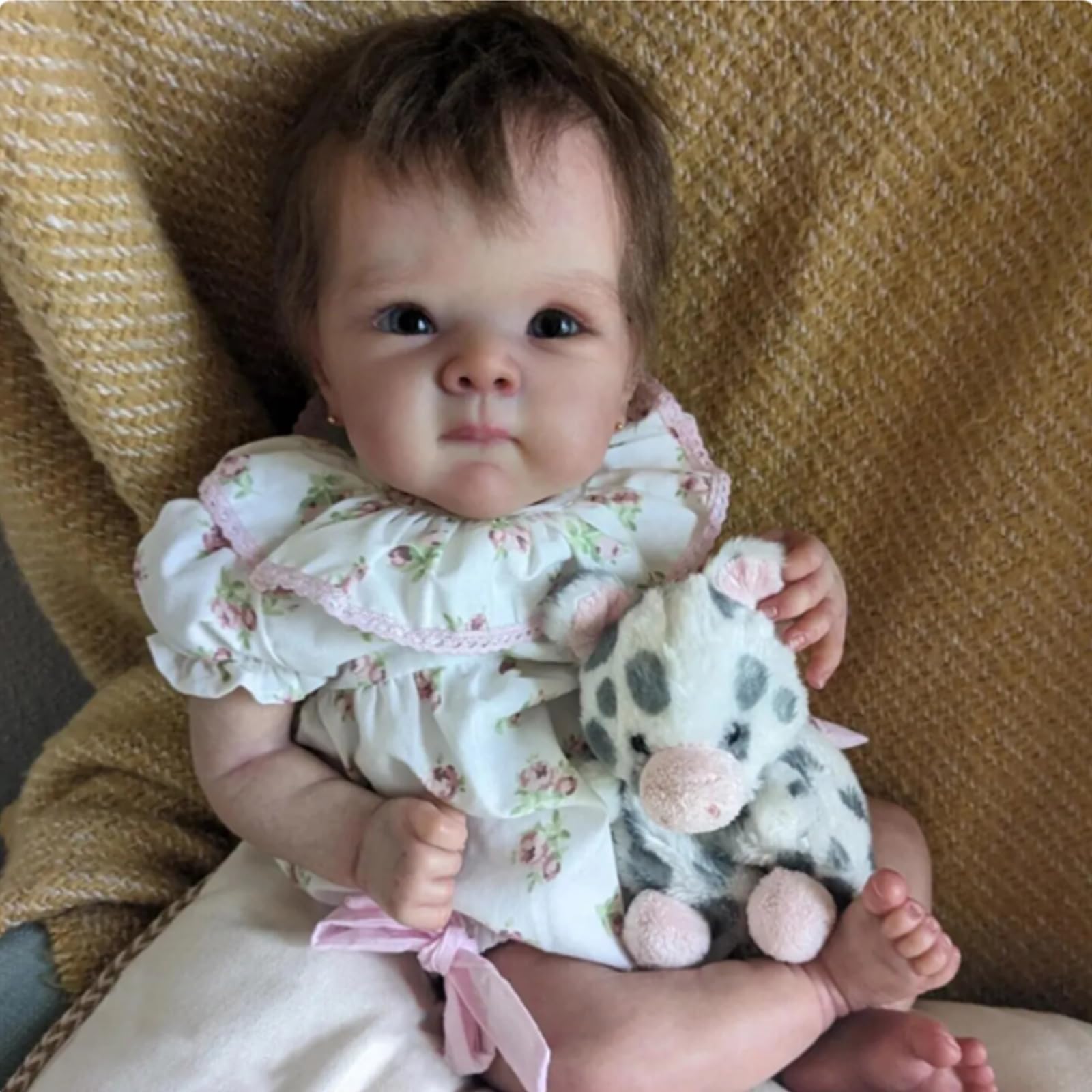 FASMAS Reborn doll floral dress detail showing realism and style