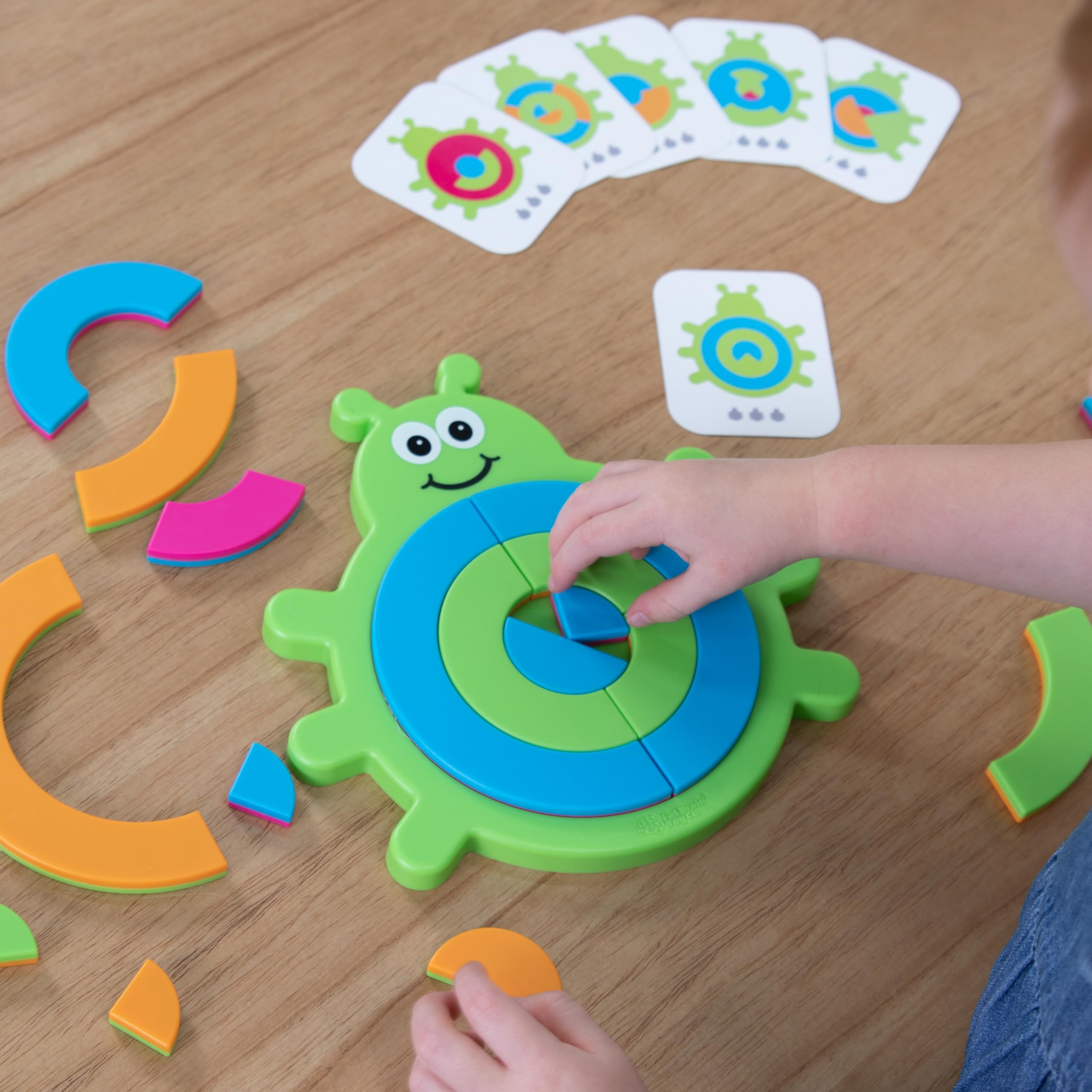 Bugzzle supports spatial reasoning and fine motor practice.