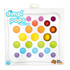 User holding the Dimpl Pops Deluxe to show compact size for on the go play