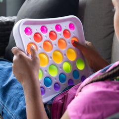 Silicone buttons on Dimpl Pops Deluxe provide tactile feedback during play