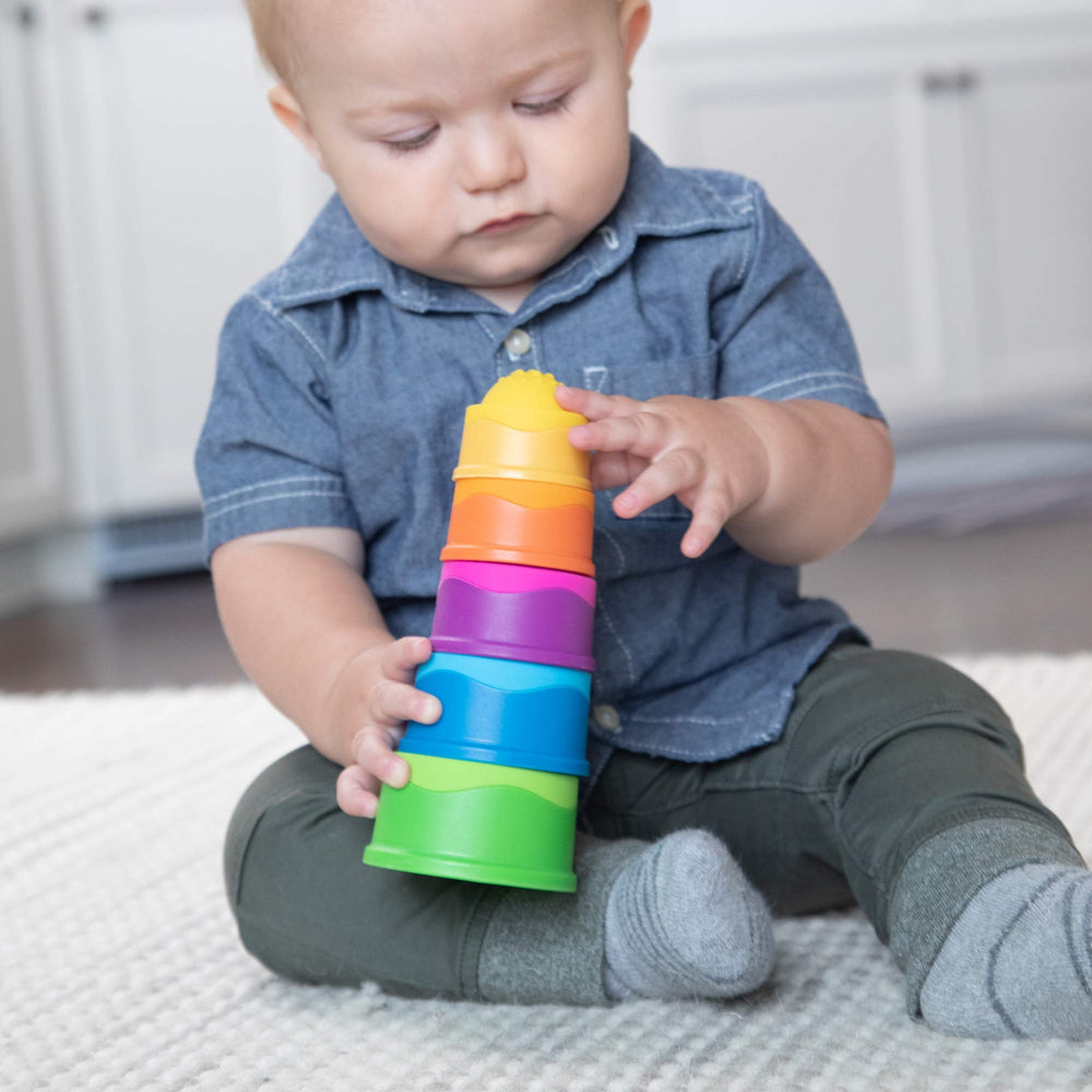 Fat Brain Toys Dimpl Stack push-pop action highlighting bubbles and fine motor play.