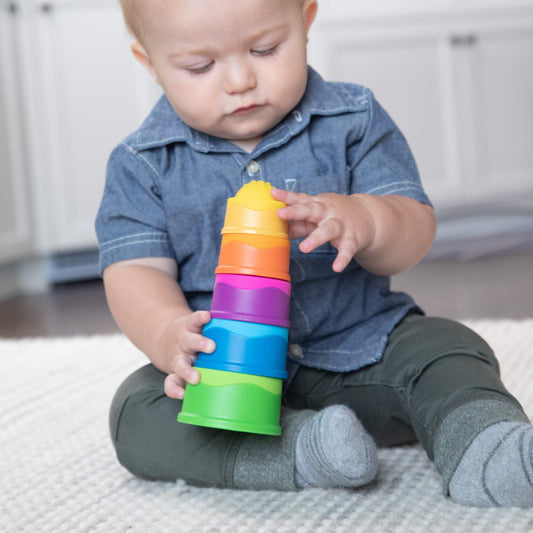 Fat Brain Toys Dimpl Stack push-pop action highlighting bubbles and fine motor play.
