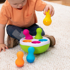 Fat Brain Toys SpinnyPins multicolored pieces boost color recognition and play.