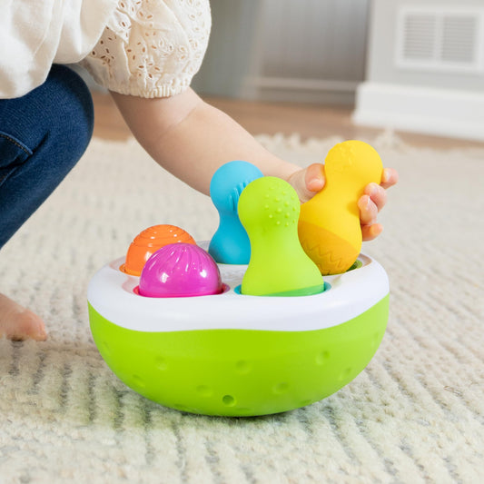 Fat Brain Toys SpinnyPins textured pins for fine motor play.
