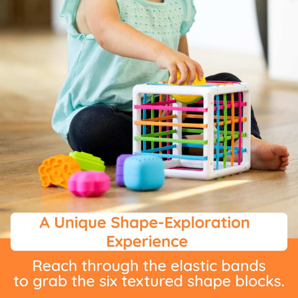 Fat Brain Toys InnyBin elastic bands invite tactile shape exploration
