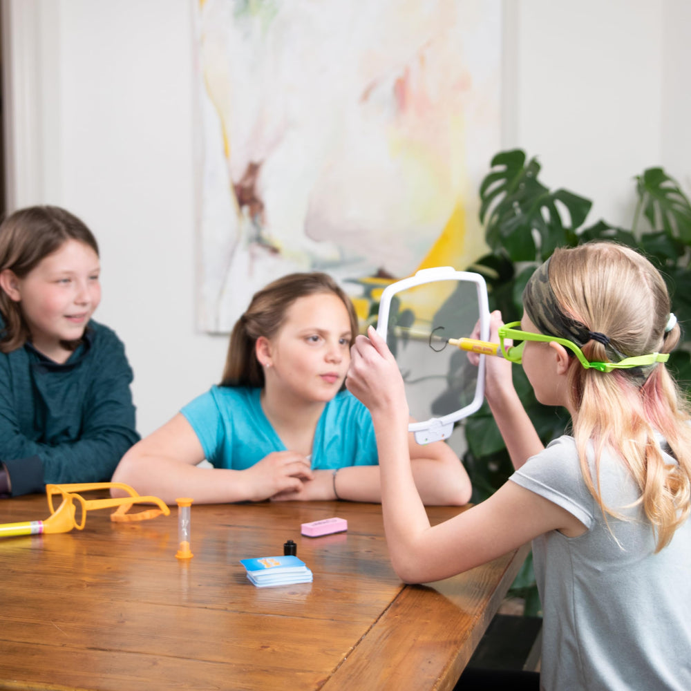 Fat Brain Toys Pencil Nose team guess features lively cooperation and creative expressions during rounds.