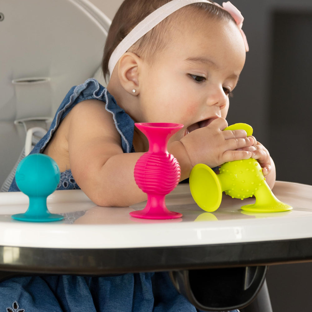 pipSquigz attached to a stroller for mobile play