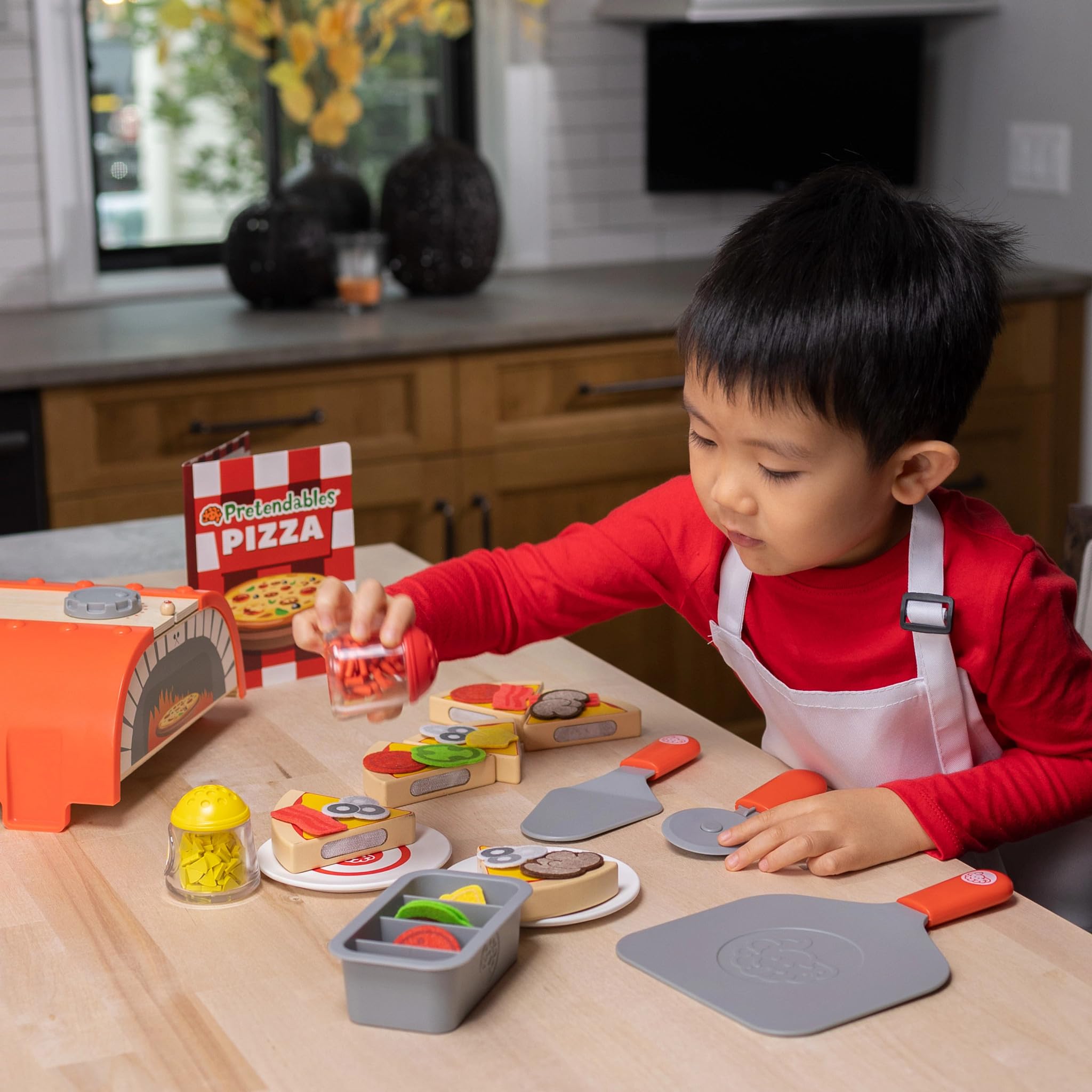 Fat Brain Toys Pretendables Backyard Pizza Oven Set pizza slices with hook-and-loop toppings