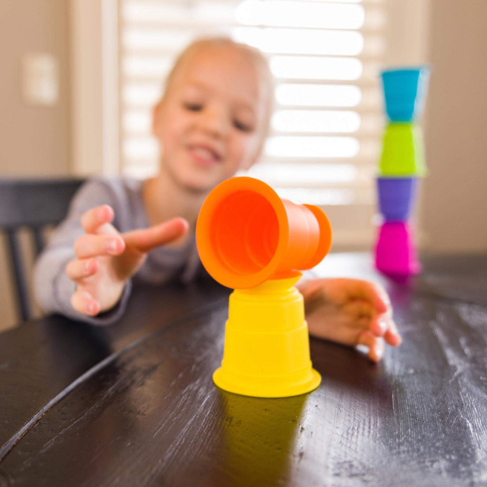 Fat Brain Toys Suction Kupz fine motor and spatial reasoning through curious stacking.