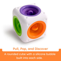 Fat Brain Toys Tugl Cube demonstrating pulling and pushing action for fine motor practice.