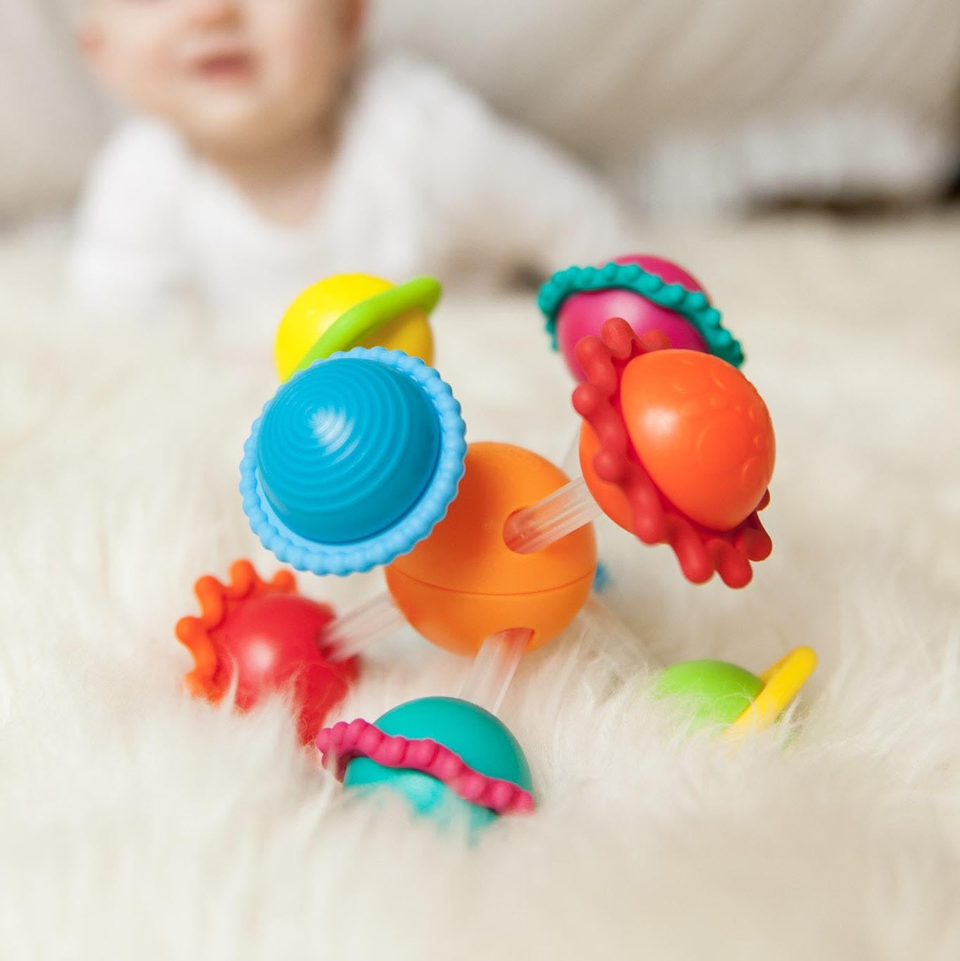 Wimzle four bars sliding through the center ball for hands-on exploration