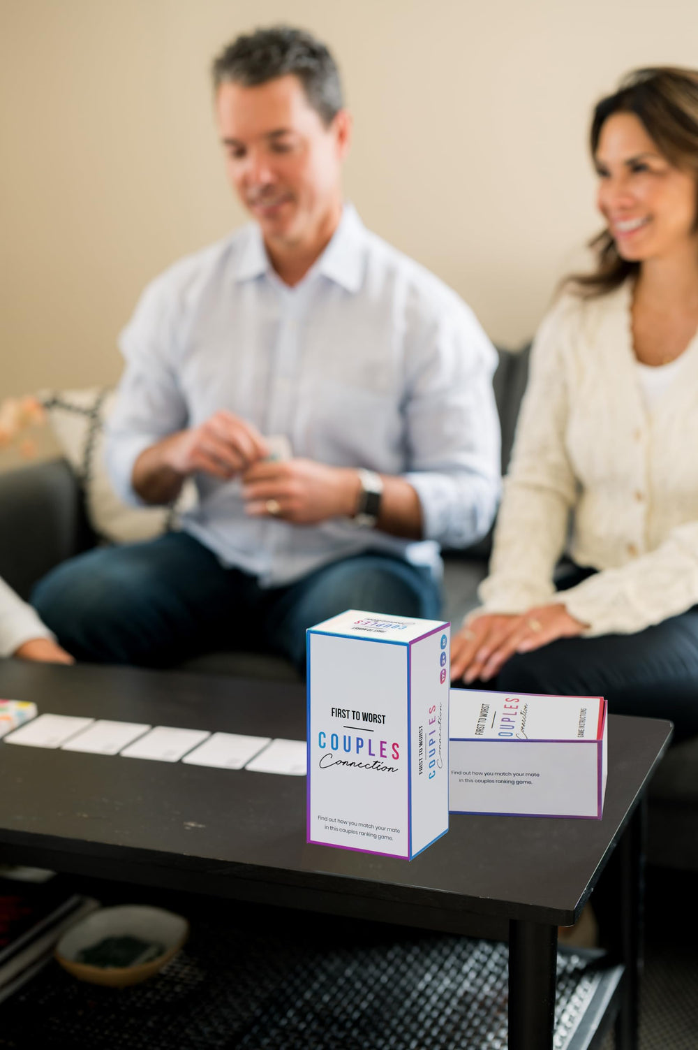 FIRST TO WORST card deck spreads across the table for quick play.