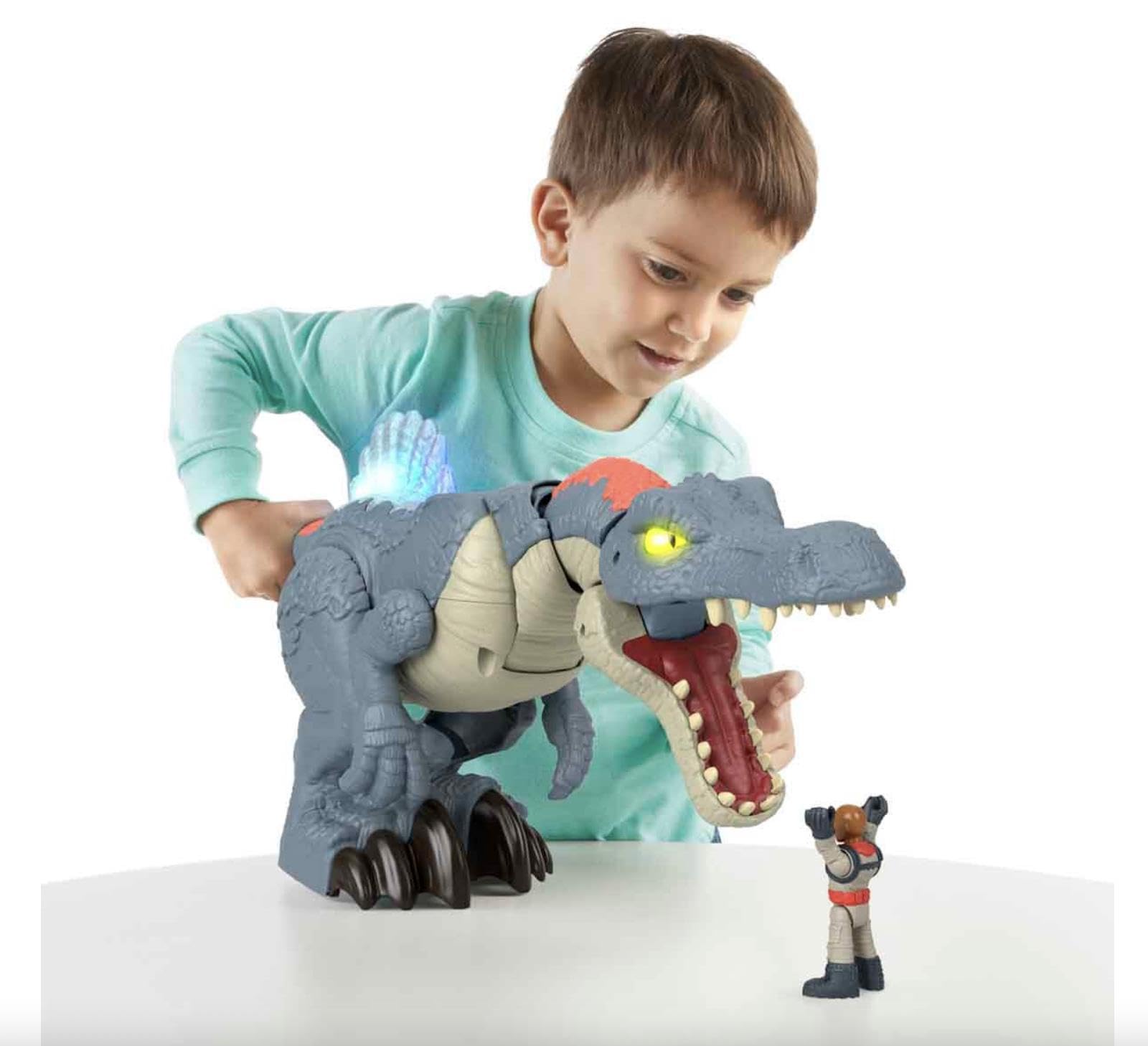 Tail-trigger action on Imaginext Spinosaurus highlighting dramatic chomping moment.