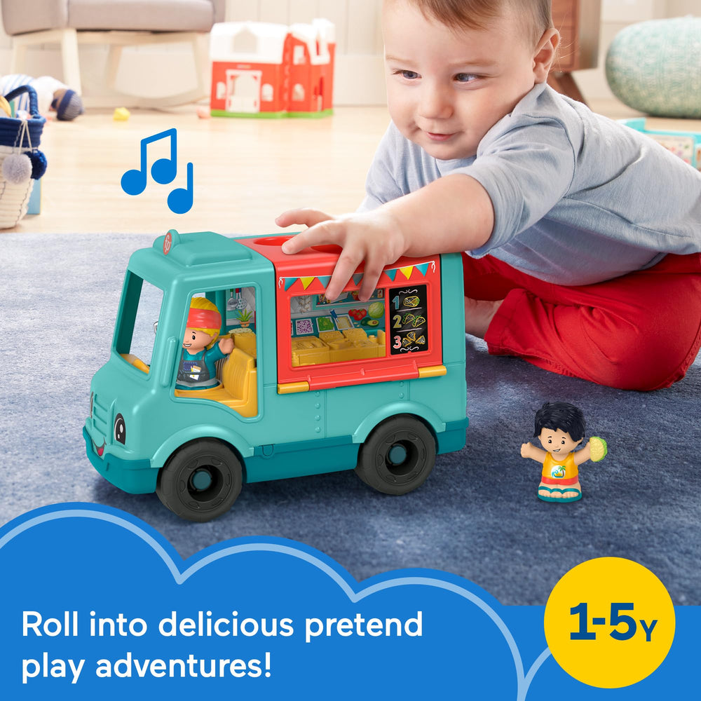 Fisher-Price Little People food truck outdoor dining area opens for pretend meals.