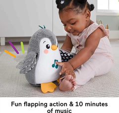 Soft plush penguin for tummy time and gentle tactile exploration.