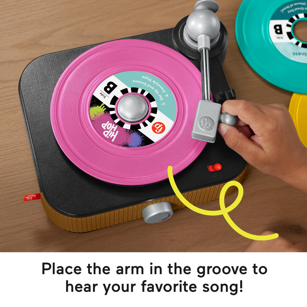 Volume knob on Fisher-Price Rockin’ Record Player lets kids control sound levels.