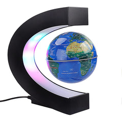 Forno floating globe with blue LED lights for stylish desk decor.