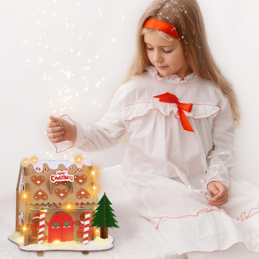 Fovths string lights illuminating finished gingerbread houses for warm ambience