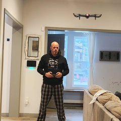 FREEZE2TRIM Black Falcon 4K Drone with travel case and compact foldable design.