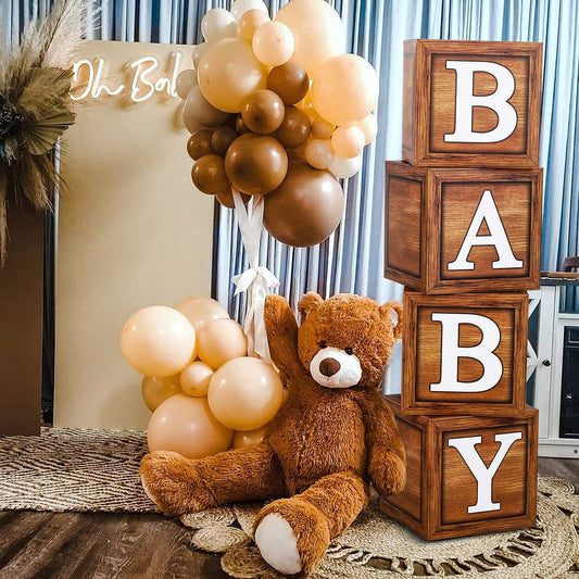 Frigg baby shower boxes with wood-grain blocks create a natural centerpiece display.