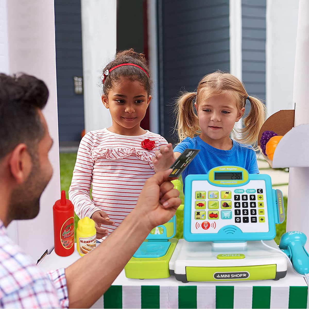 FS Pretend Play Cash Register calculator aiding price checks during imaginative shopping.