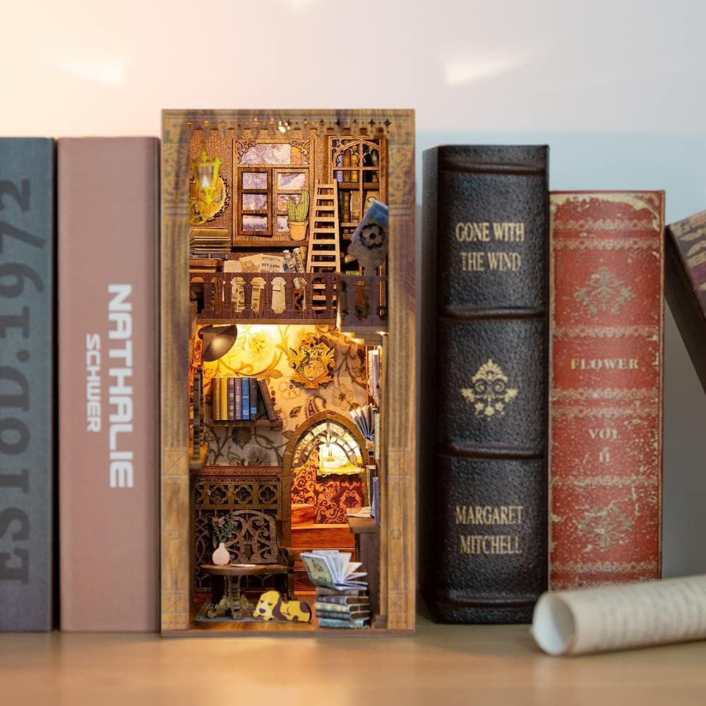 Fsolis Book Nook Kit LED lights illuminate a cozy bookshelf diorama