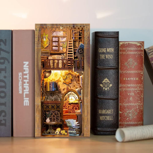 Fsolis Book Nook Kit LED lights illuminate a cozy bookshelf diorama