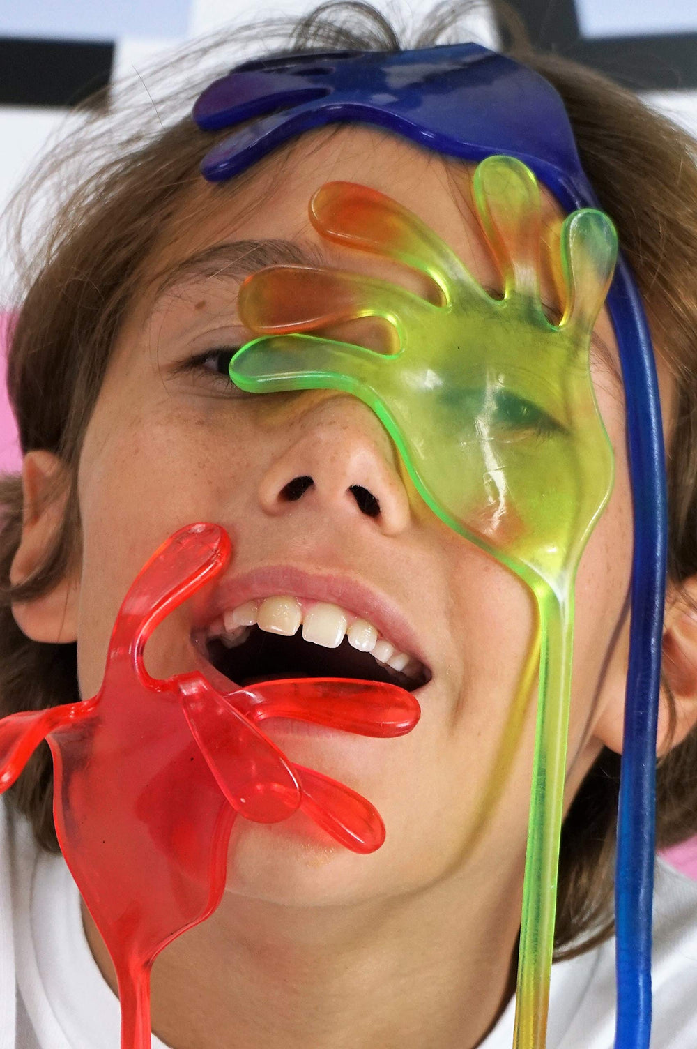Fun A Ton giant sticky hand pink ideal for party favors and sensory fun.