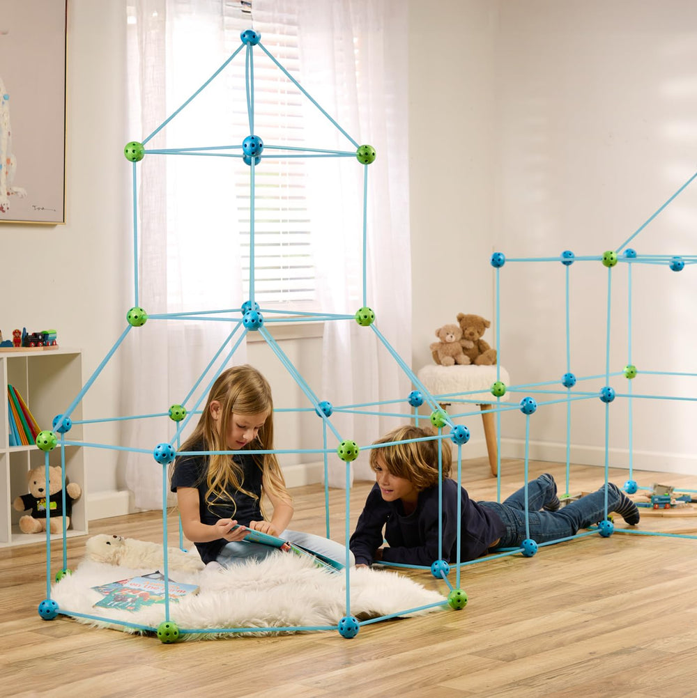 Kids building a fort and tunnel with FUNbelievable kit, engaging imagination